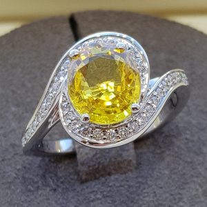 Yellow sapphire and diamond platinum cocktail ring, swirl design